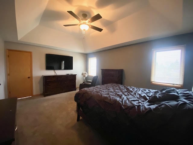 1702 Elm Street Spring Grove, IL 60081 - Photo 13 of 30 a bedroom with a bed and a flat tv screen on dresser