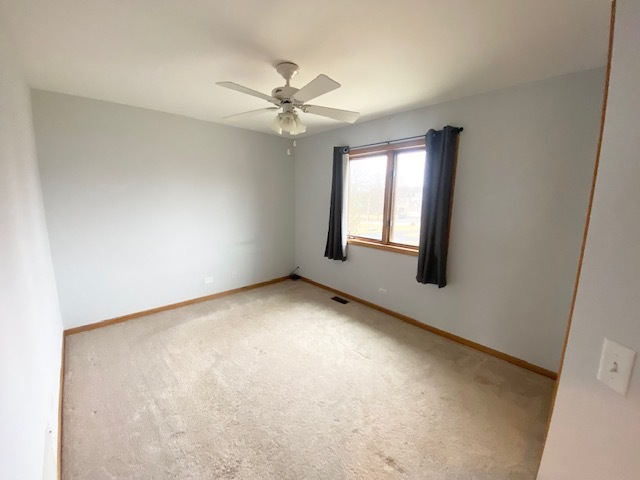 1702 Elm Street Spring Grove, IL 60081 - Photo 16 of 30 a view of an empty room with a window