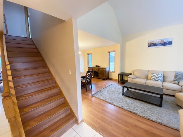 1702 Elm Street Spring Grove, IL 60081 - Photo 2 of 30 a living room with furniture and a rug