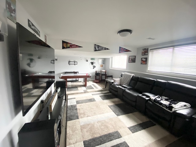 1702 Elm Street Spring Grove, IL 60081 - Photo 22 of 30 a living room with furniture and a window