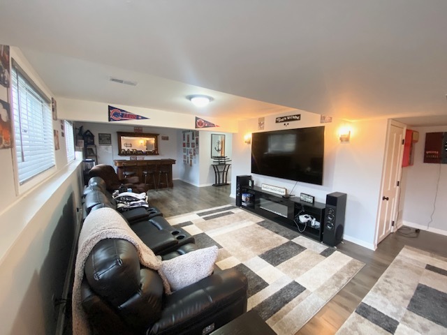 1702 Elm Street Spring Grove, IL 60081 - Photo 25 of 30 a living room with furniture and a flat screen tv