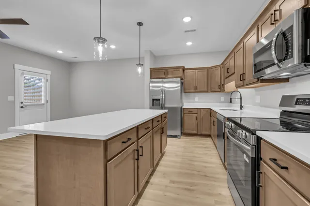 a kitchen with a sink and cabinets