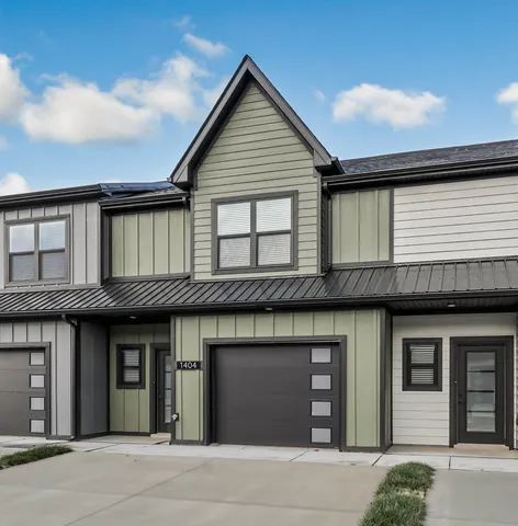 a view of a hallway with wooden floor and entryway