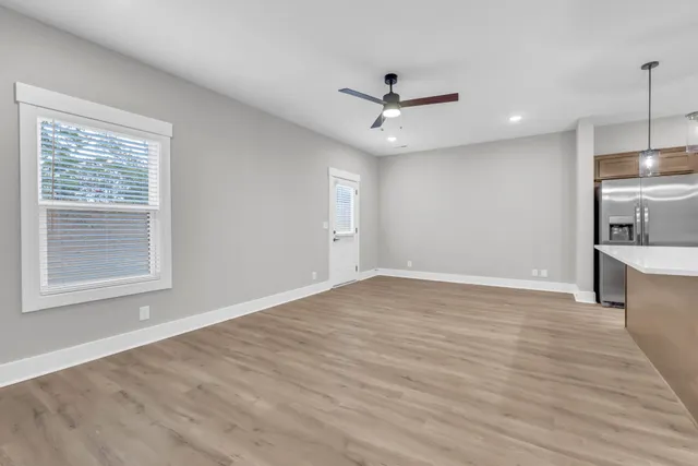 a large kitchen with kitchen island a sink stainless steel appliances and cabinets
