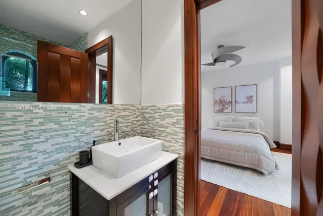 a bathroom with a sink and a mirror