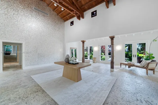 a view of a living room and entryway