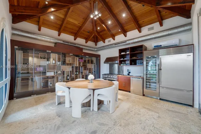 a dining space with furniture and a kitchen