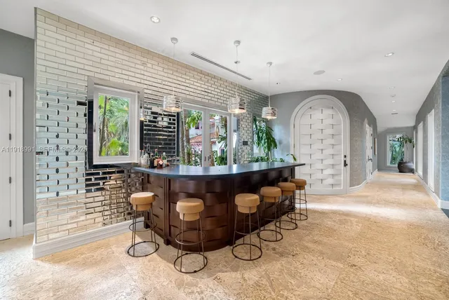 a living room with furniture a window and a fireplace