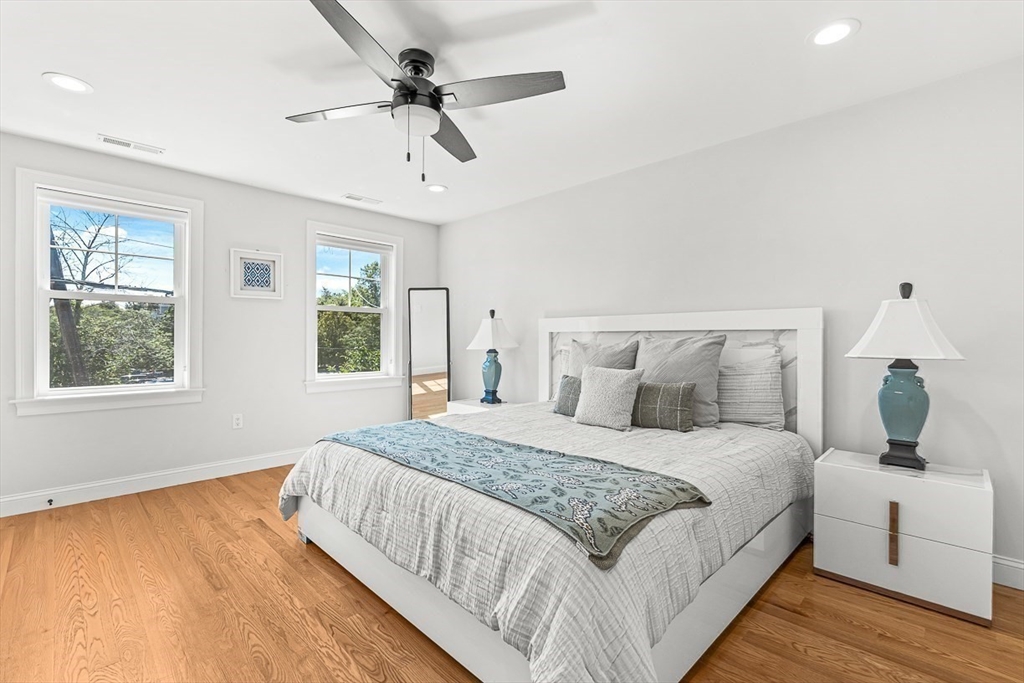 237 Swanton Street Winchester, MA 01890 - Photo 16 of 34 a bedroom with a large bed and a window