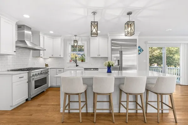 a kitchen with a sink cabinets and window