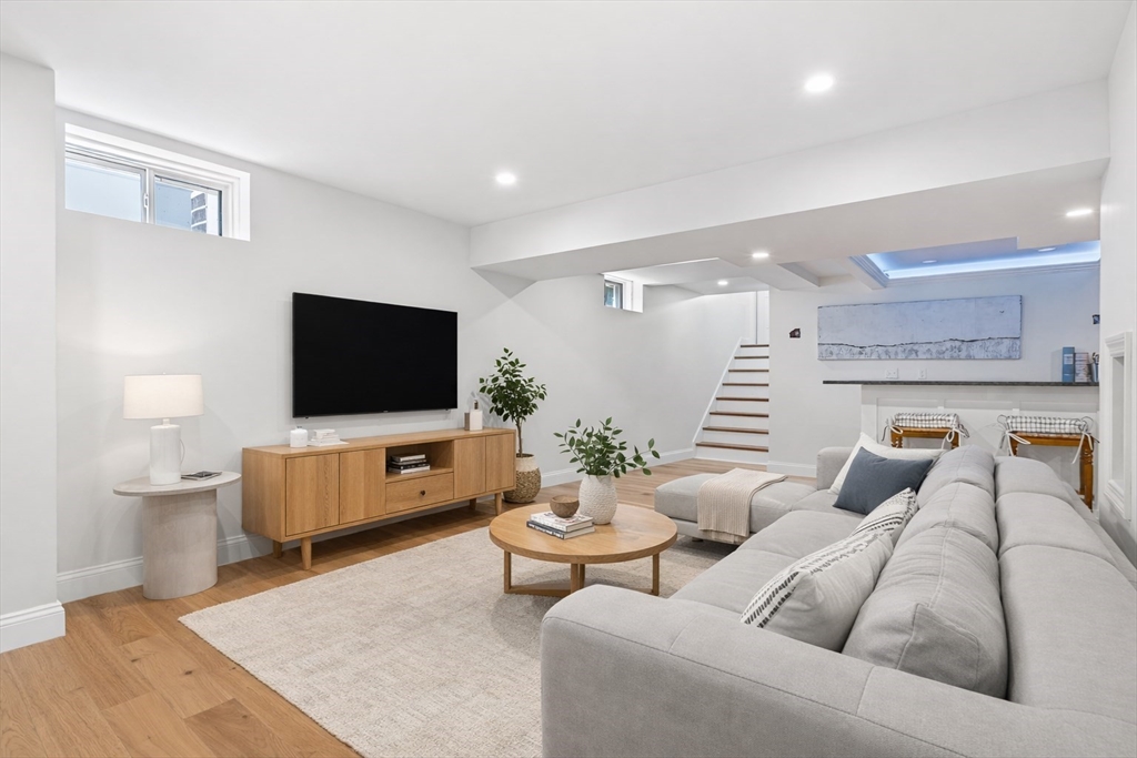237 Swanton Street Winchester, MA 01890 - Photo 26 of 34 a living room with furniture and a flat screen tv