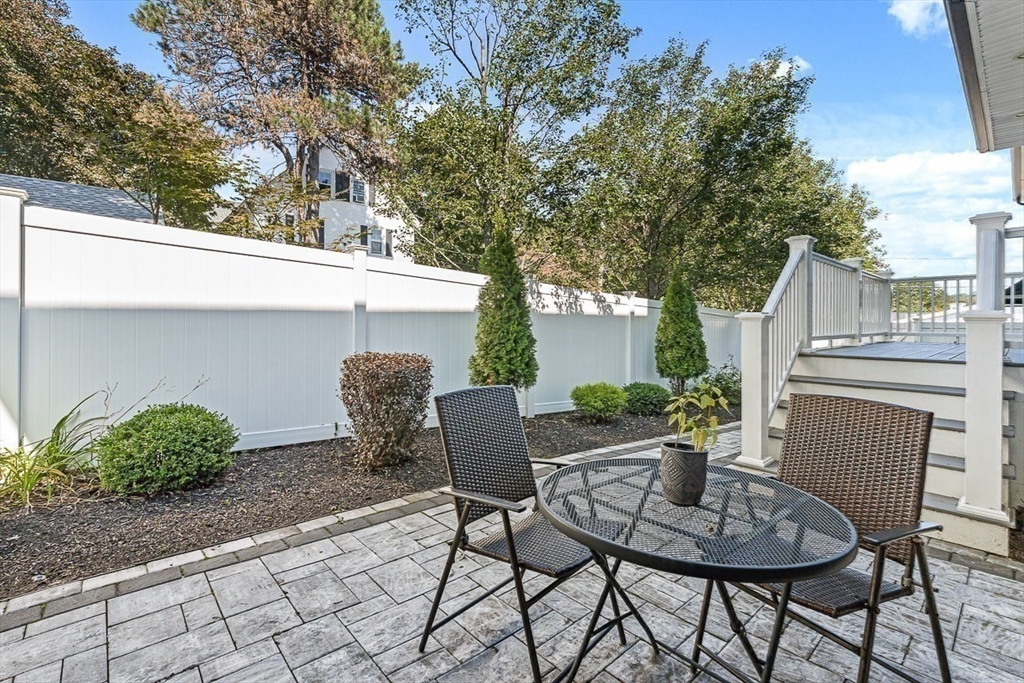 237 Swanton Street Winchester, MA 01890 - Photo 31 of 34 a view of a chair and table in backyard of the house