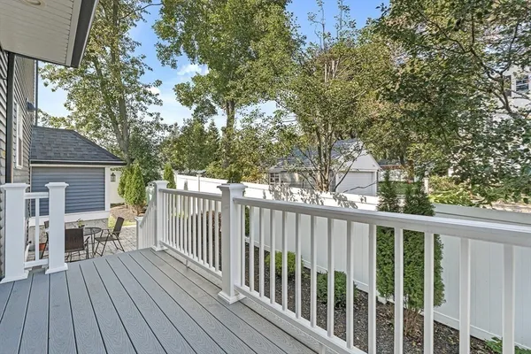 a view of a wooden deck and a yard