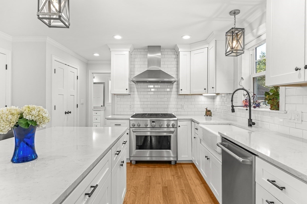 237 Swanton Street Winchester, MA 01890 - Photo 4 of 34 a kitchen with a sink stove and cabinets