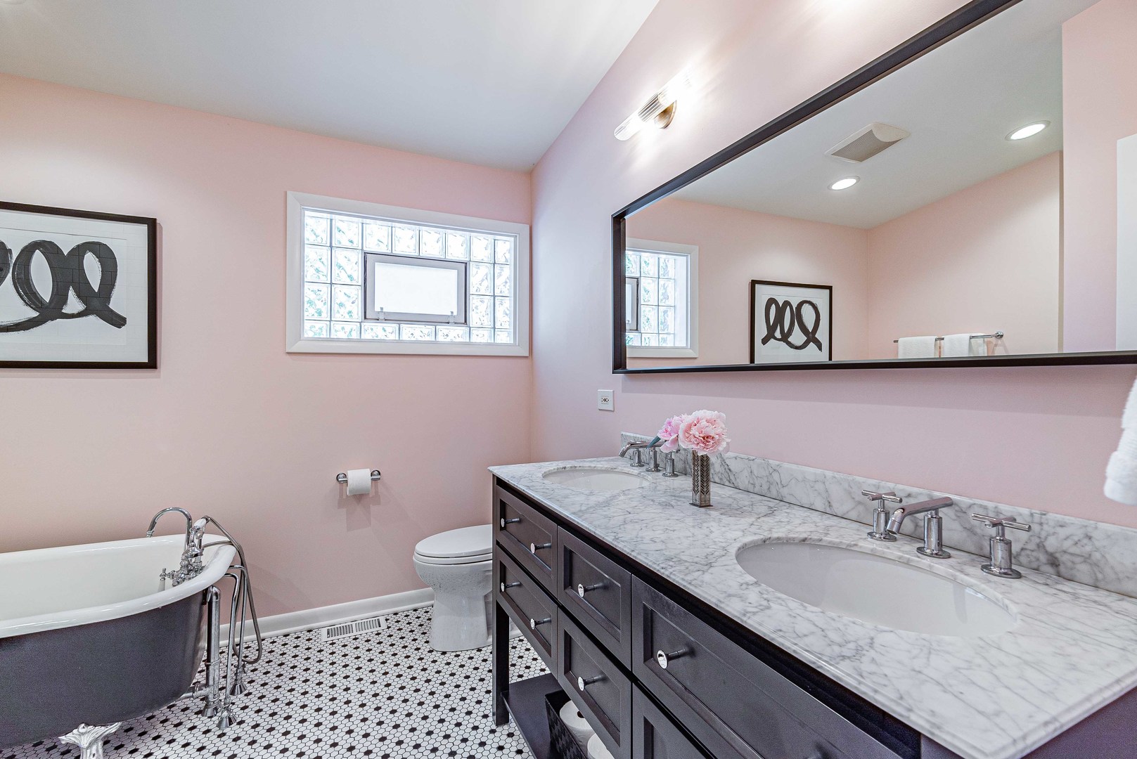 1146 Rago Avenue Deerfield, IL 60015 - Photo 12 of 25 a bathroom with a granite countertop double vanity sink a mirror and a toilet