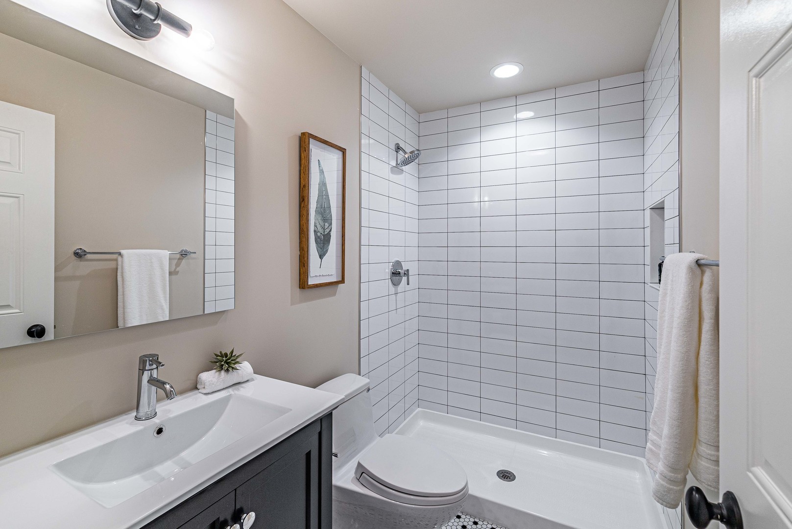 1146 Rago Avenue Deerfield, IL 60015 - Photo 19 of 25 a bathroom with a bathtub shower sink mirror and toilet