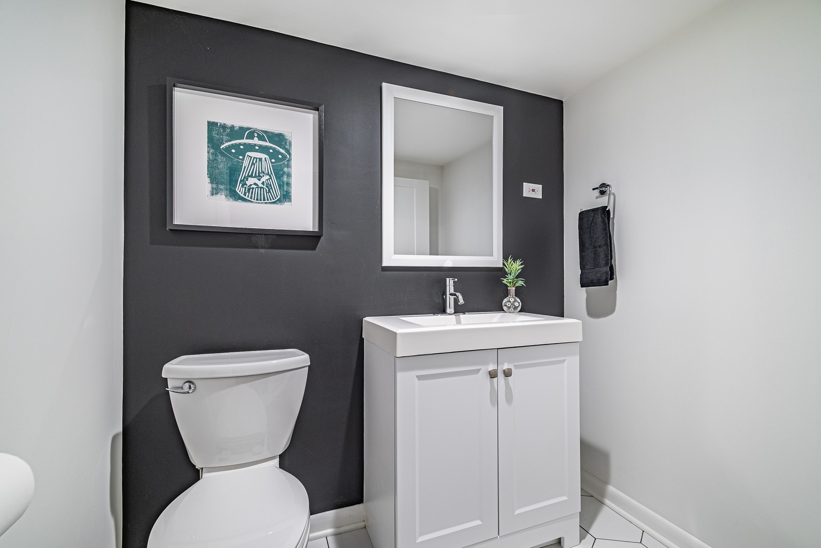 1146 Rago Avenue Deerfield, IL 60015 - Photo 22 of 25 a bathroom with a toilet sink and mirror