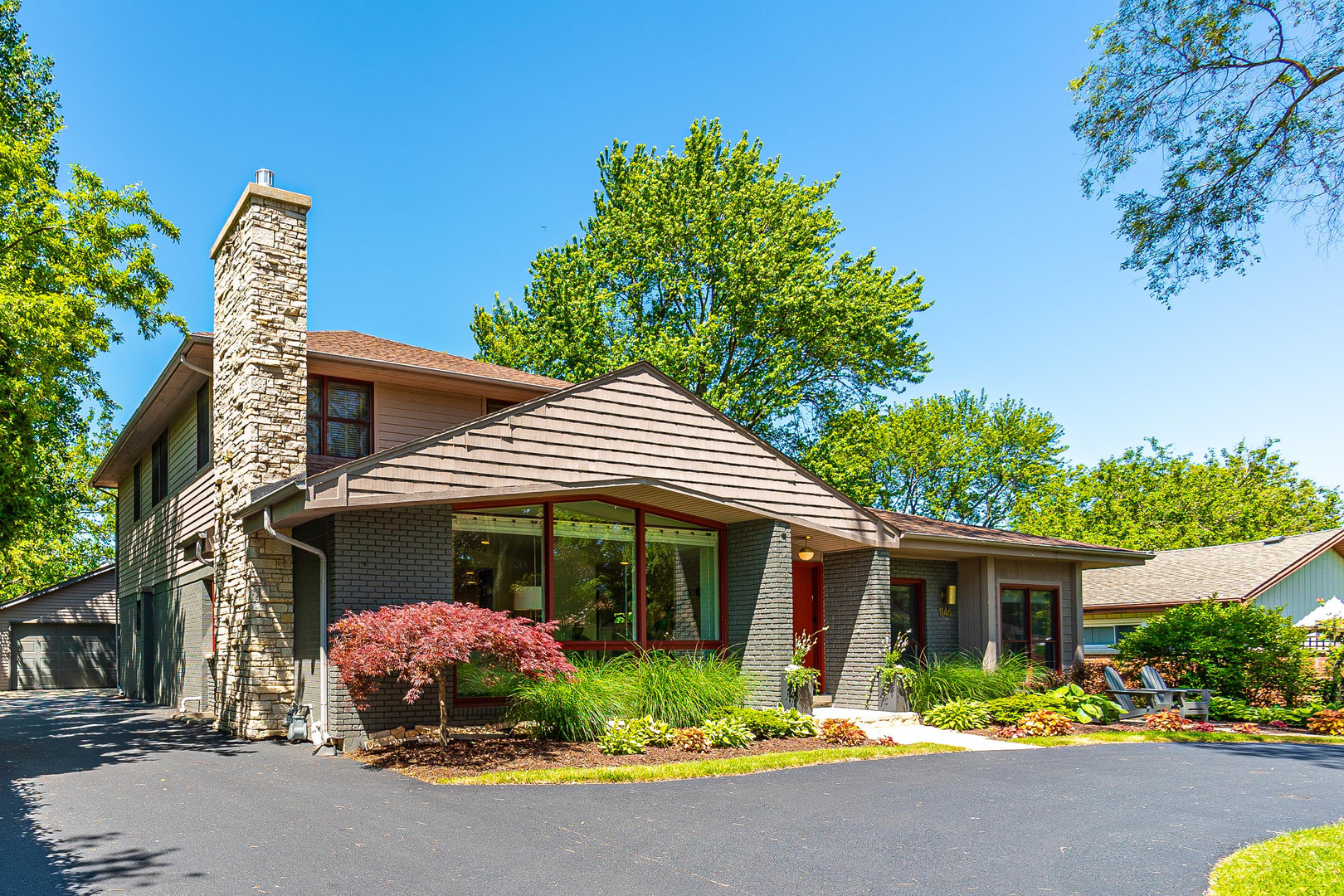 1146 Rago Avenue Deerfield, IL 60015 - Photo 24 of 25 a front view of a house with garden
