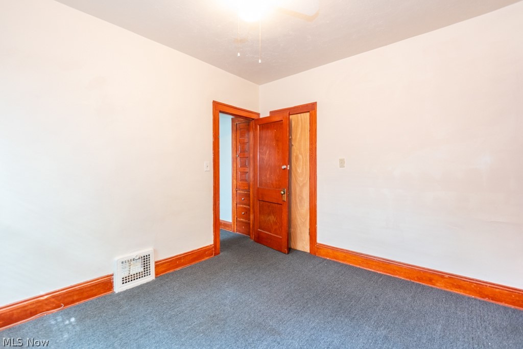 917 Helmsdale Road Cleveland Heights, OH 44112 - Photo 20 of 28 Carpeted spare room featuring baseboards