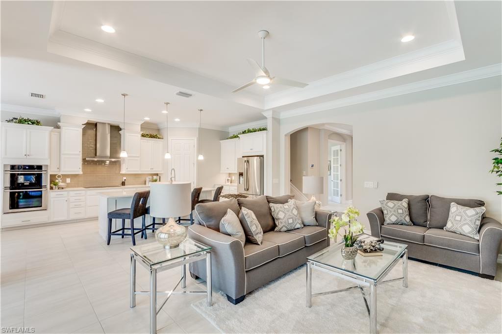 1423 Mockingbird Drive Naples, FL 34120 - Photo 12 of 26 a living room with furniture kitchen and a chandelier