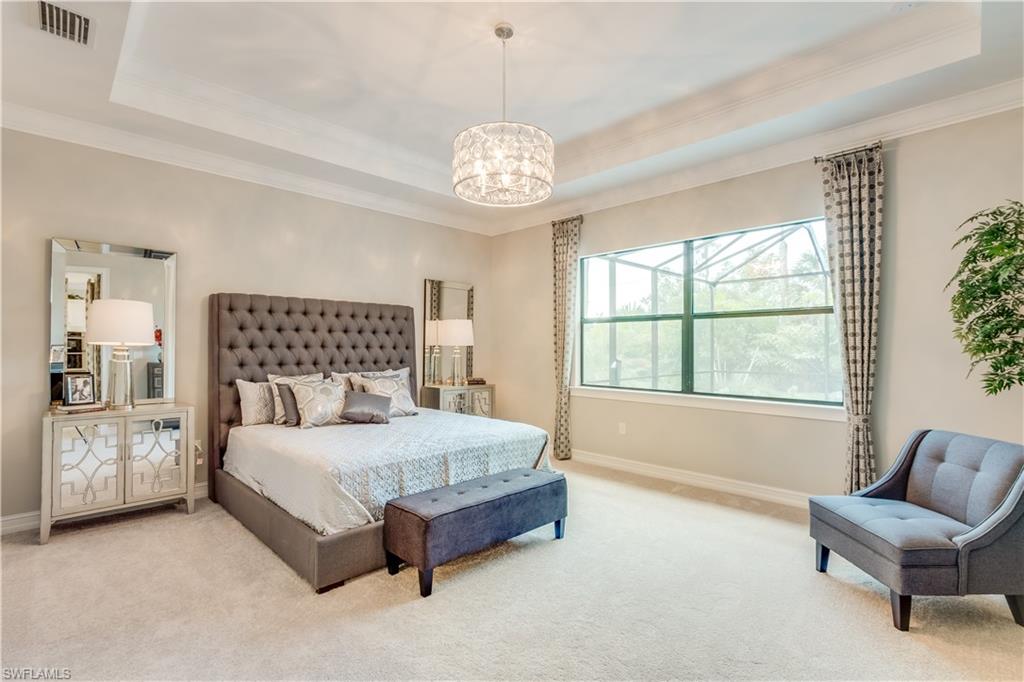 1423 Mockingbird Drive Naples, FL 34120 - Photo 14 of 26 a bedroom with a bed and a window