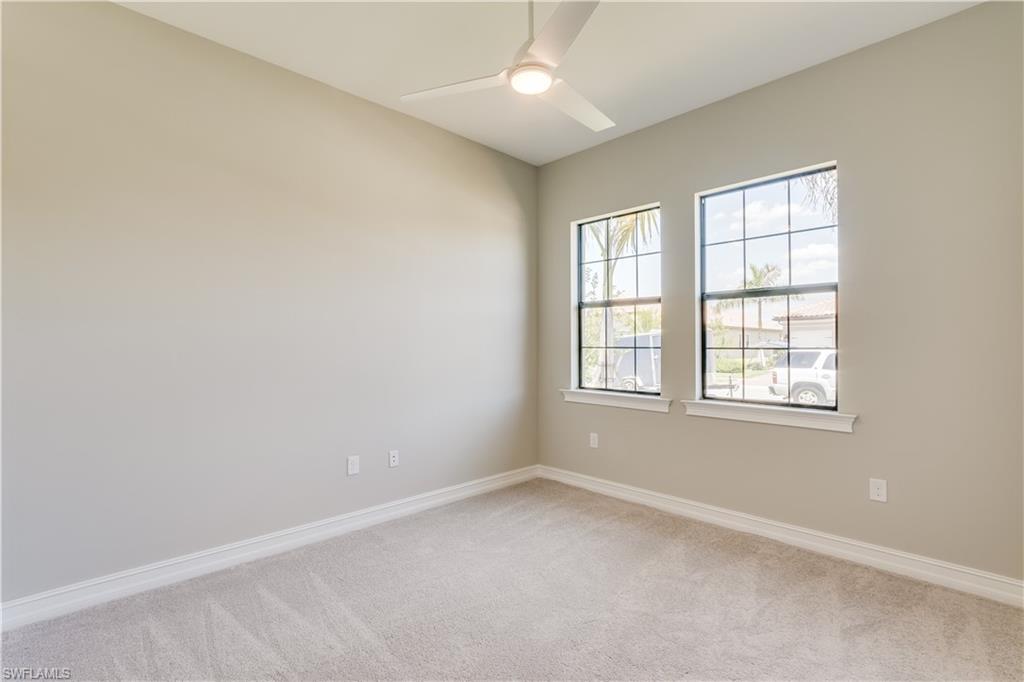 1423 Mockingbird Drive Naples, FL 34120 - Photo 16 of 26 an empty room with a window