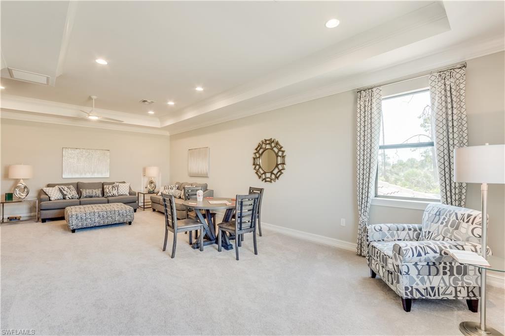 1423 Mockingbird Drive Naples, FL 34120 - Photo 18 of 26 a living room with furniture and a window