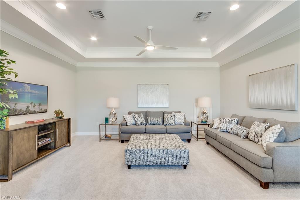 1423 Mockingbird Drive Naples, FL 34120 - Photo 19 of 26 a living room with furniture and a couch