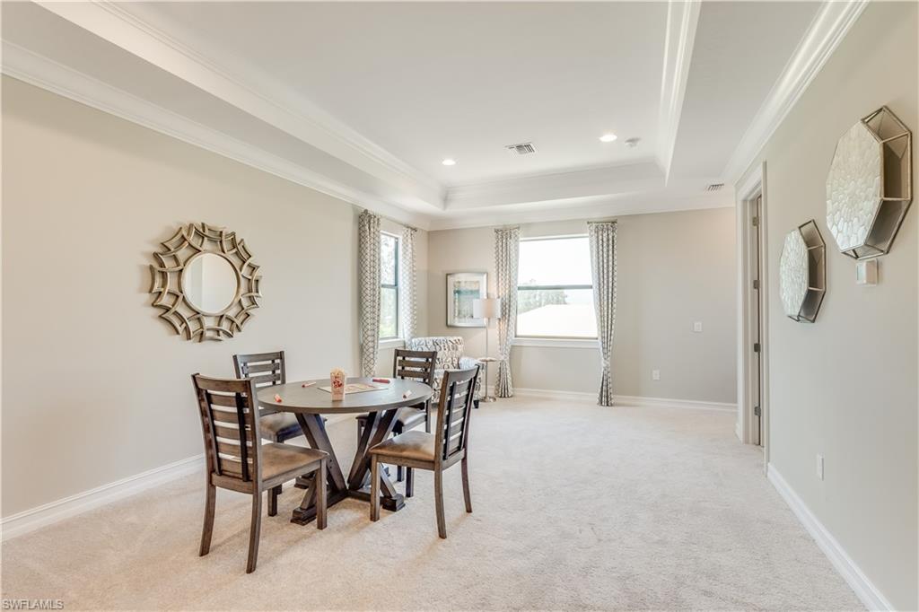 1423 Mockingbird Drive Naples, FL 34120 - Photo 20 of 26 a view of a dining room with furniture window and wooden floor