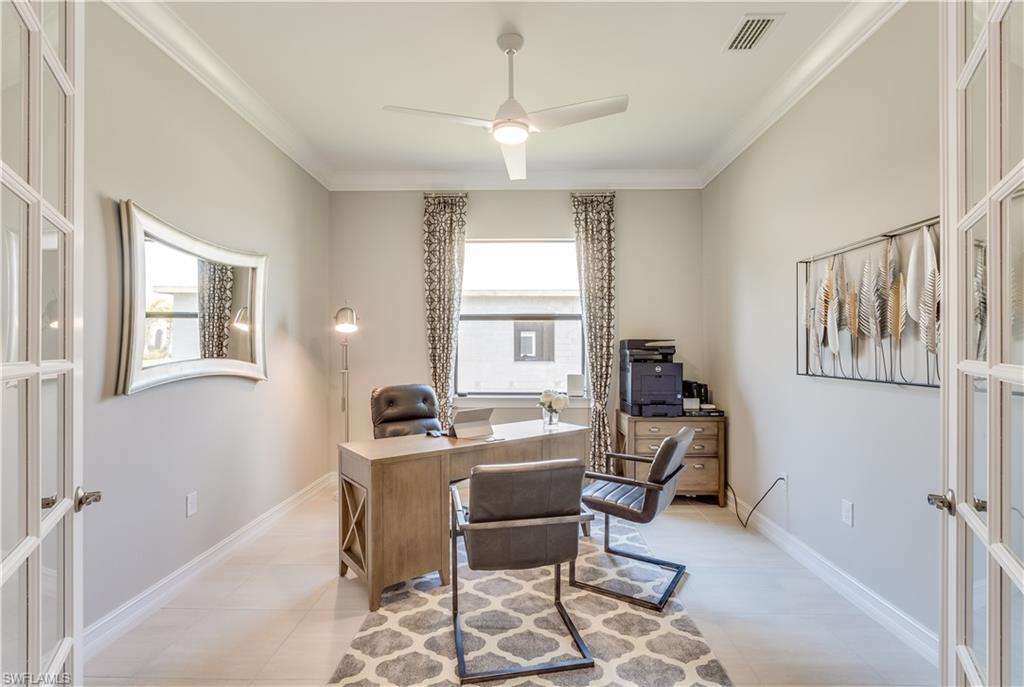 1423 Mockingbird Drive Naples, FL 34120 - Photo 22 of 26 a workspace with furniture and a window