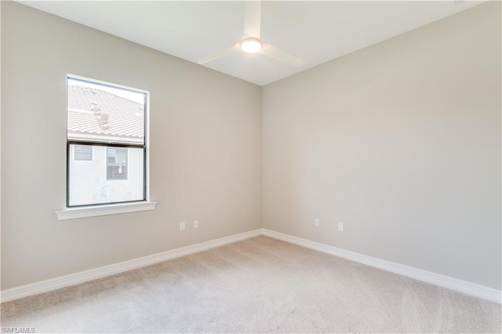 1423 Mockingbird Drive Naples, FL 34120 - Photo 24 of 26 an empty room with a window