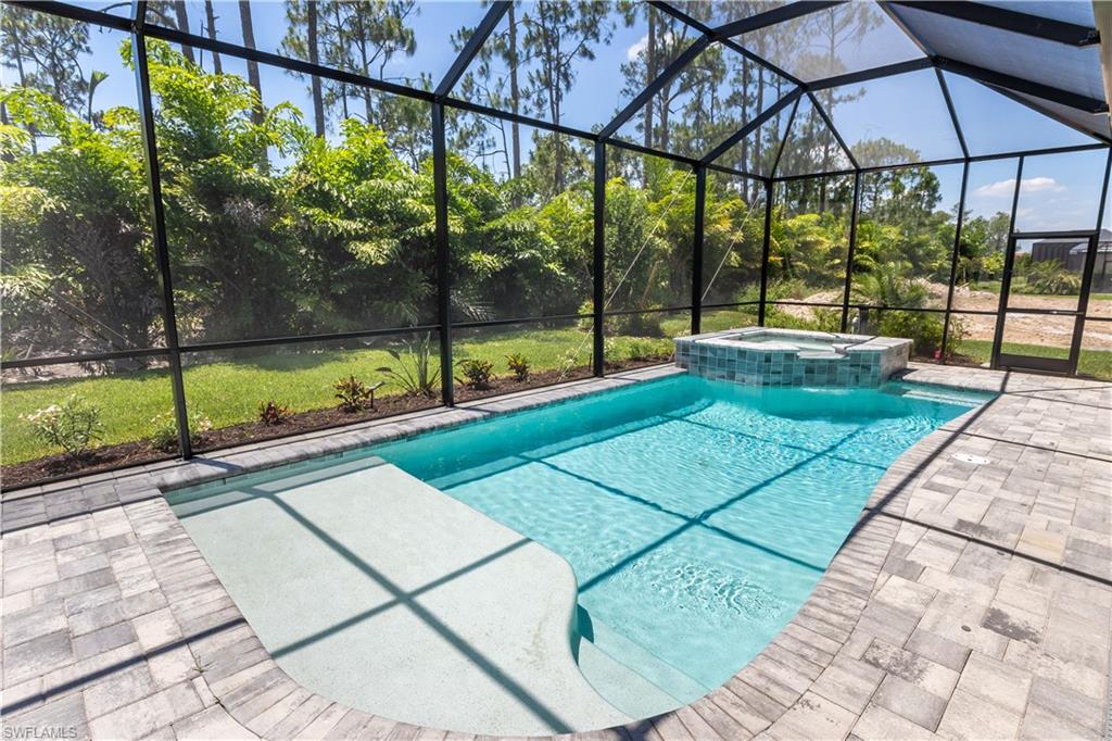 1423 Mockingbird Drive Naples, FL 34120 - Photo 3 of 26 a view of swimming pool with a patio