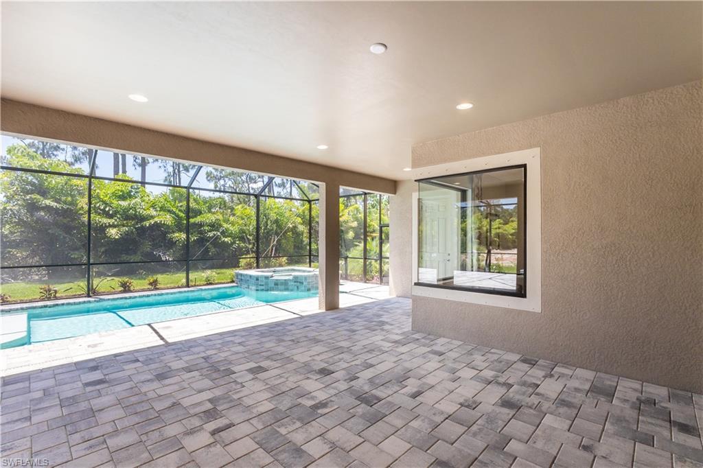 1423 Mockingbird Drive Naples, FL 34120 - Photo 6 of 26 a view of an empty room with a large window