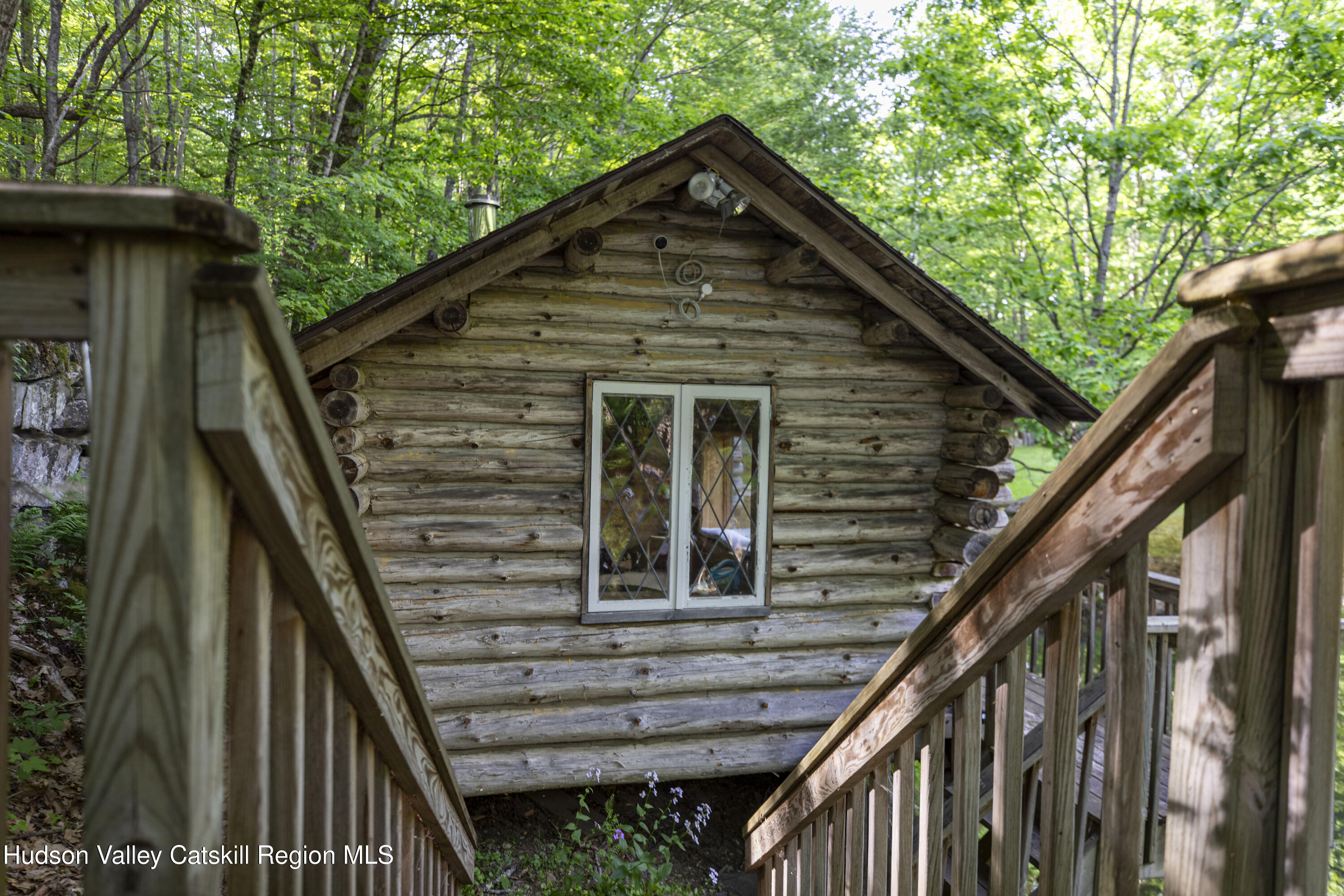 22 Old Mill Road Stephentown, NY 12169 - Photo 47 of 55 a front view of a house with wooden stairs and deck