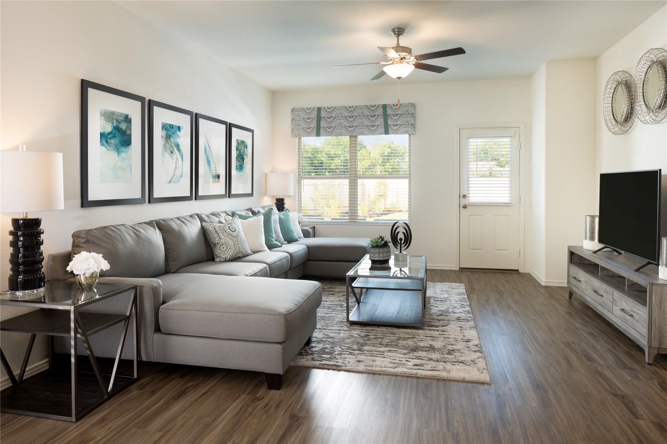 105 Parsons Kyle, TX 78640 - Photo 11 of 17 a living room with furniture a flat screen tv and a large window