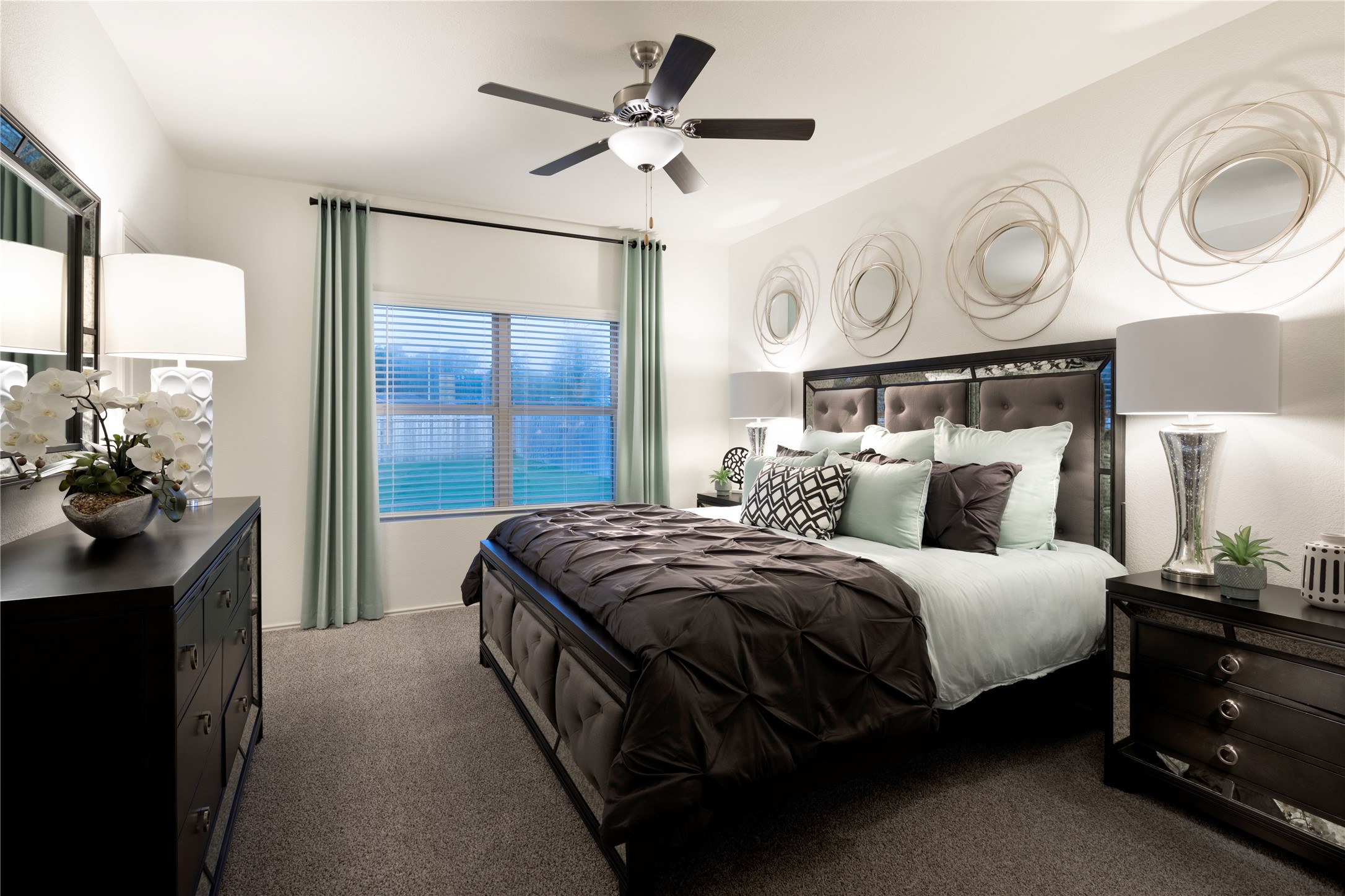 105 Parsons Kyle, TX 78640 - Photo 14 of 17 a bedroom with bed and a chandelier