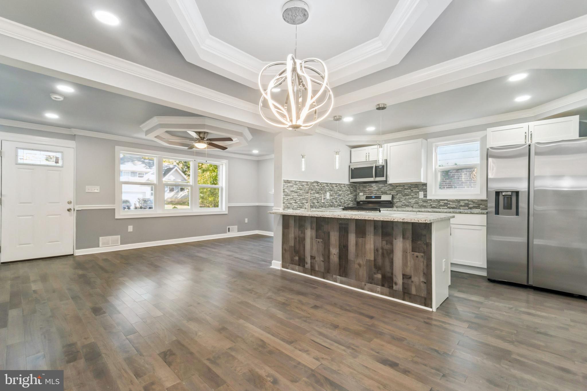 6804 Carol Road Baltimore, MD 21207 - Photo 5 of 25 Modern elegance in an open living space.