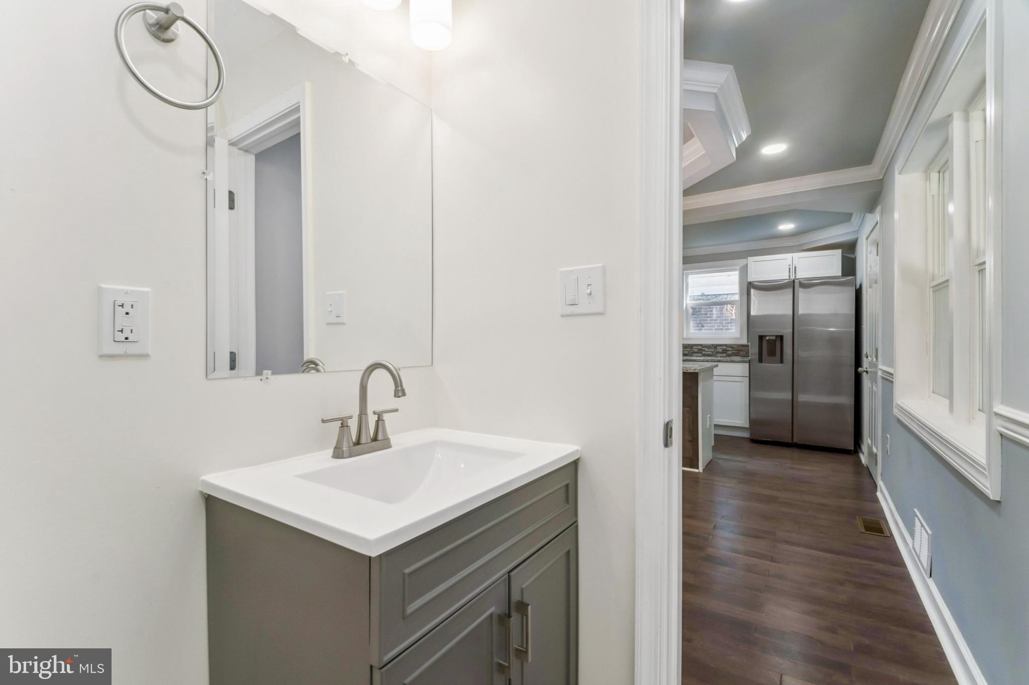 6804 Carol Road Baltimore, MD 21207 - Photo 7 of 25 Sleek modern bathroom with stylish fixtures.