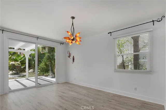 a view of a hallway with a chandelier