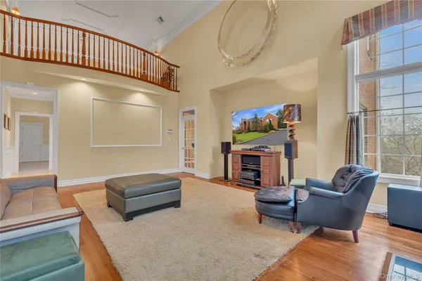 a living room with furniture a fireplace and a potted plant