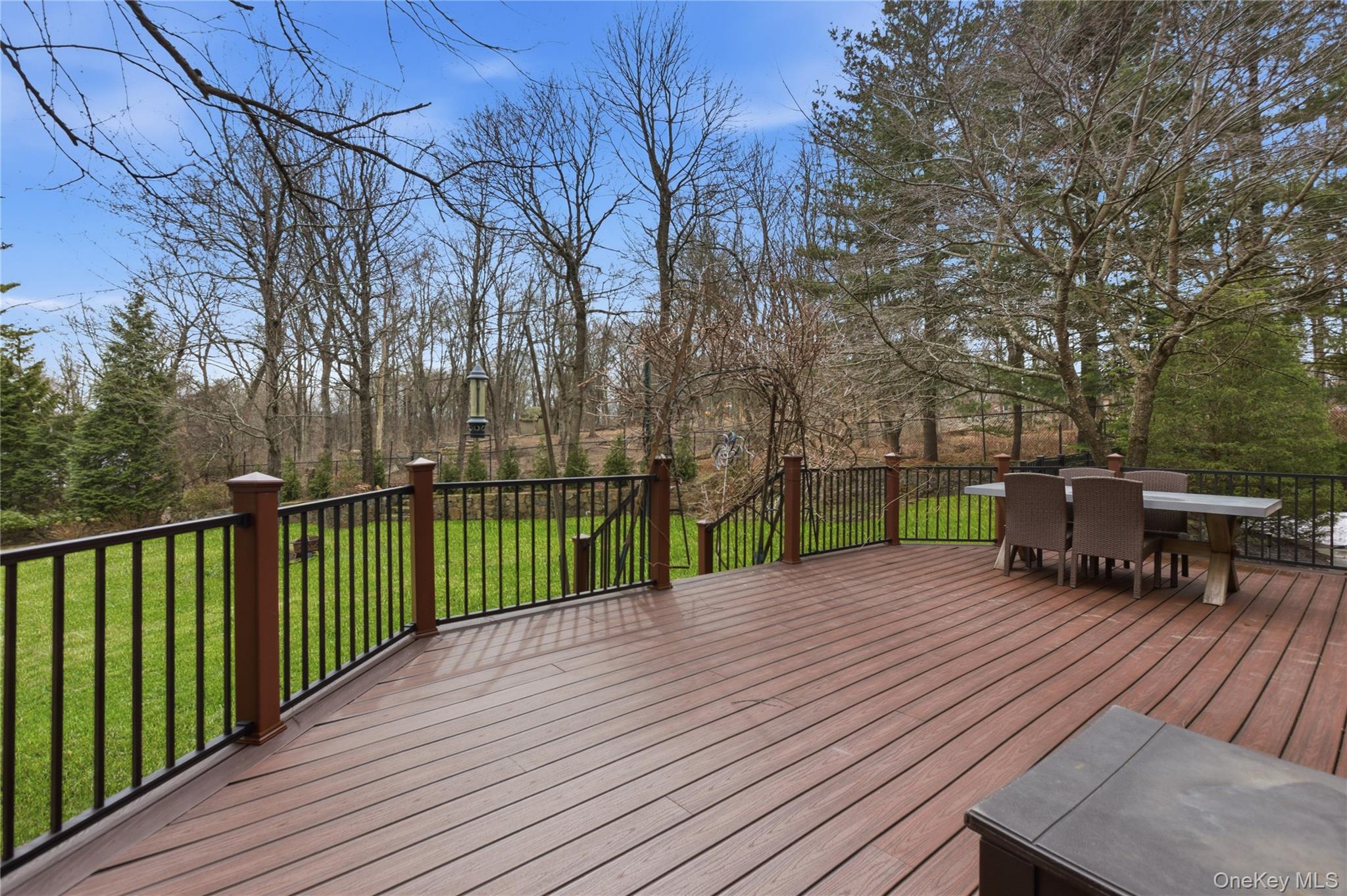 199 Hirst Road Briarcliff Manor, NY 10510 - Photo 16 of 50 Expansive Trex Deck across the back of the home overlooks the lush, level backyard. Separate fenced vegetable garden in rear as well. the backyard is accessible from doors out from the Family Room and Kitchen.