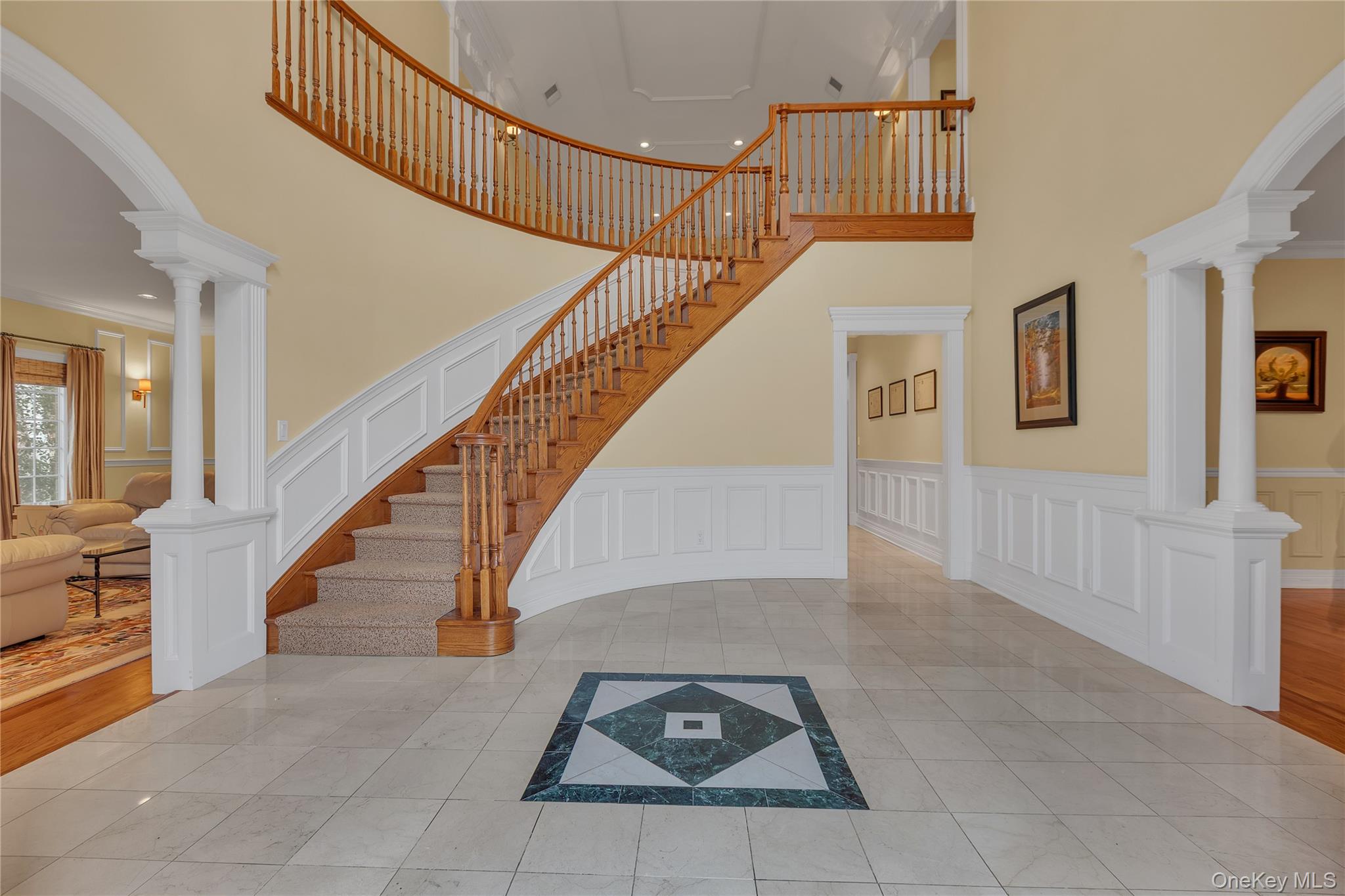 199 Hirst Road Briarcliff Manor, NY 10510 - Photo 22 of 50 Back to the front Entrance Foyer (view from the double doors) and the winding wood staircase with runner, for a tour of the upper level.