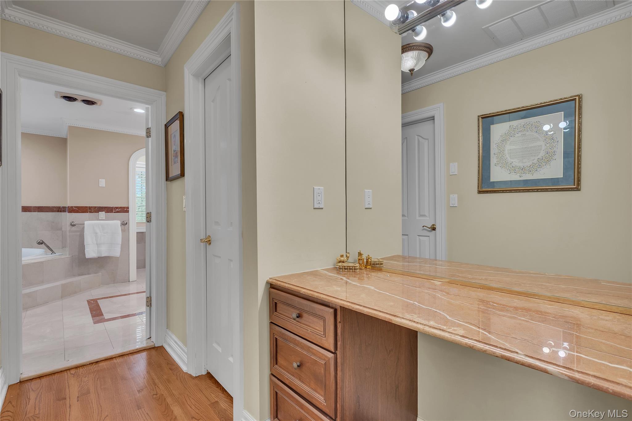 199 Hirst Road Briarcliff Manor, NY 10510 - Photo 26 of 50 Dressing Area with marble vanity & two walk-in custom closets, leading to Primary Bathroom.