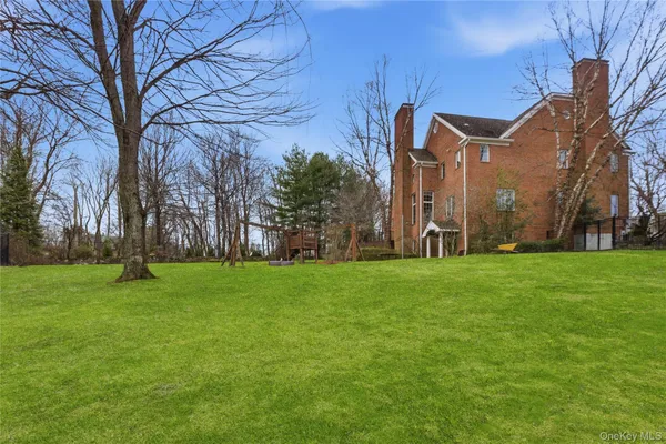 a backyard of a house with lots of green space