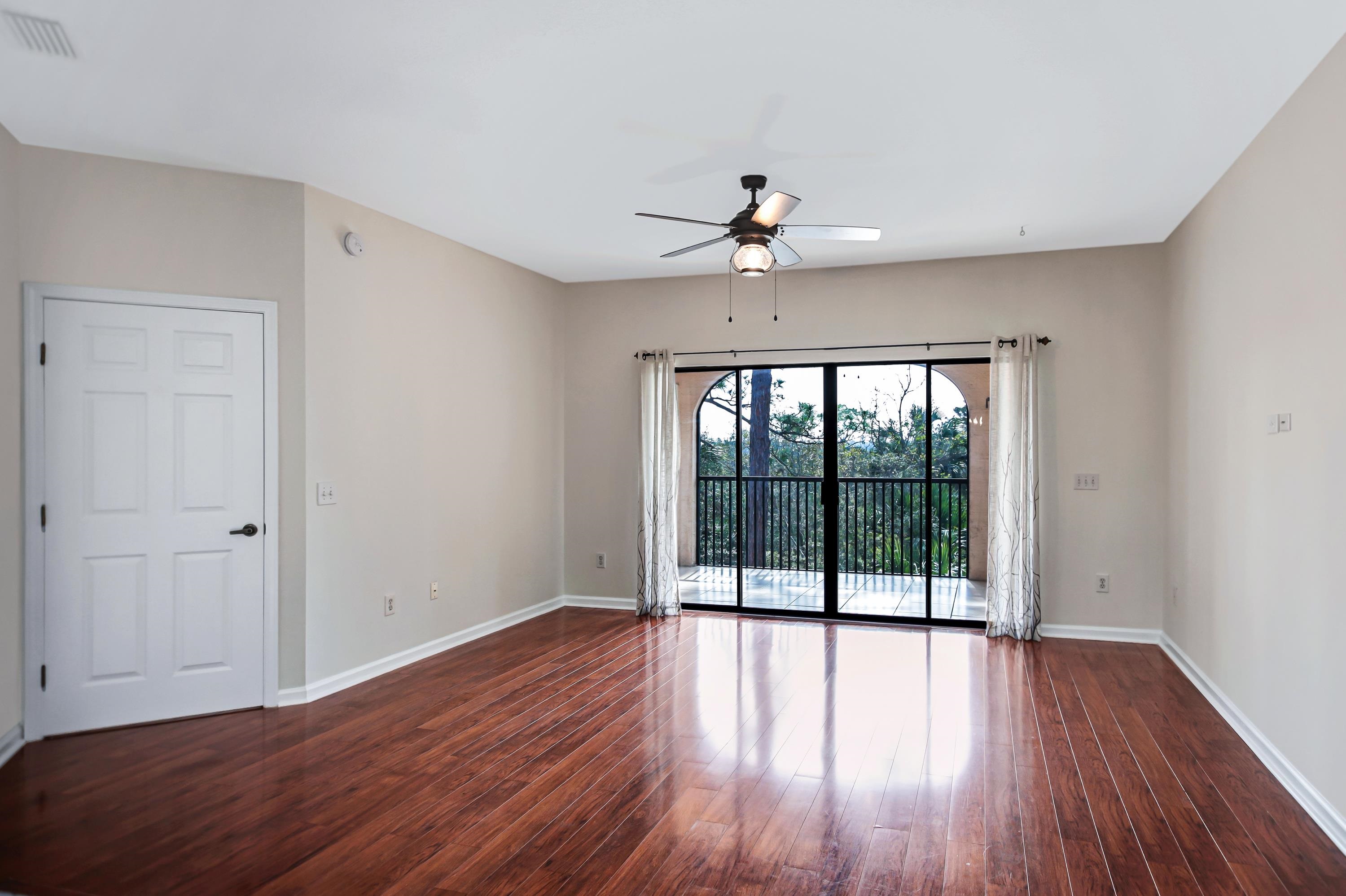 3327 Haley Pointe Road, Unit 3327 St. Augustine, FL 32084 - Photo 7 of 27 a view of empty room with wooden floor and fan