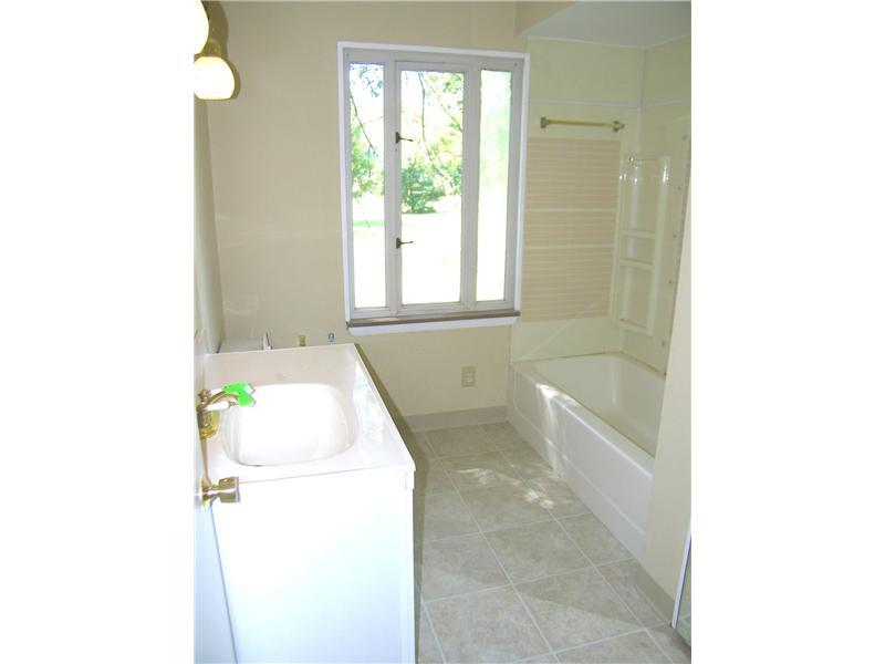 427 Blackhawk Road Beaver Falls, PA 15010 - Photo 12 of 19 Full Bath. The main bath features new ceramic tile flooring, white vanity, tub with surround, and a large linen closet!