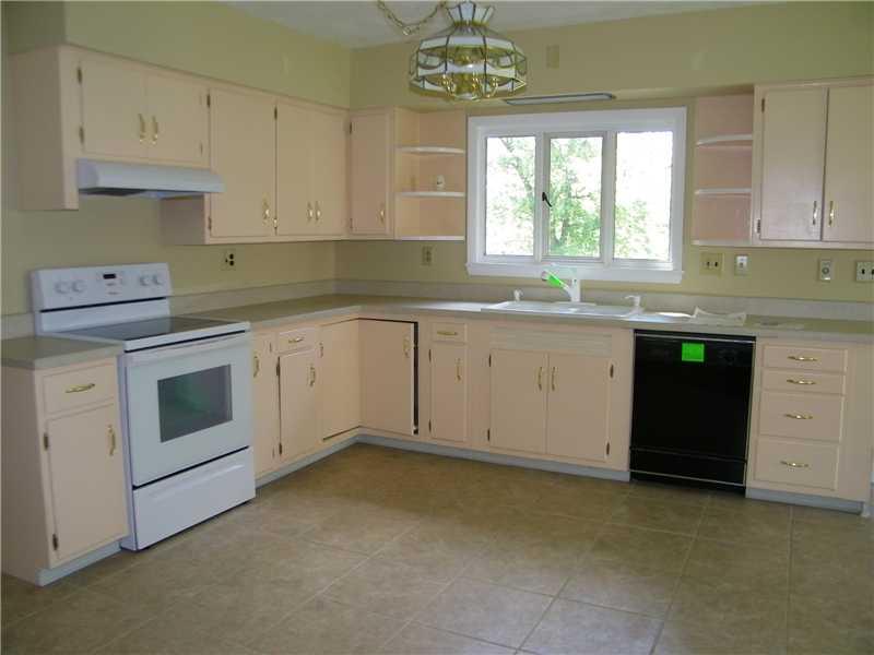 427 Blackhawk Road Beaver Falls, PA 15010 - Photo 5 of 19 Kitchen. WOW What a Kitchen! Just bring the pots and pans! Generous cabinety is highlighted by newer countertops and new ceramic tile flooring. Notice the upscale, extra deep double bowl porcelain sink and newer fixtures.