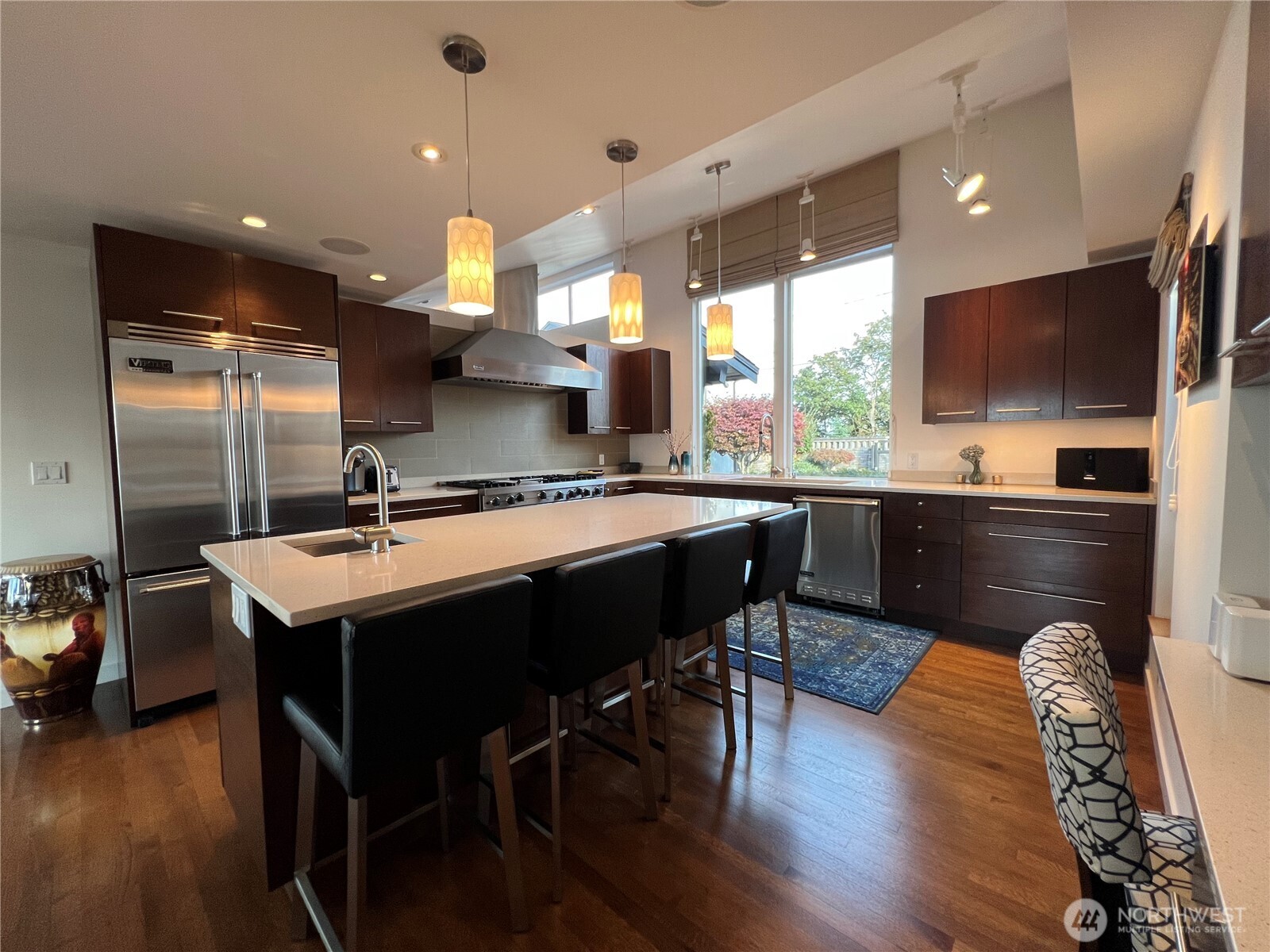 19605 Military Road South SeaTac, WA 98188 - Photo 17 of 40 a kitchen with a table chairs sink and cabinets