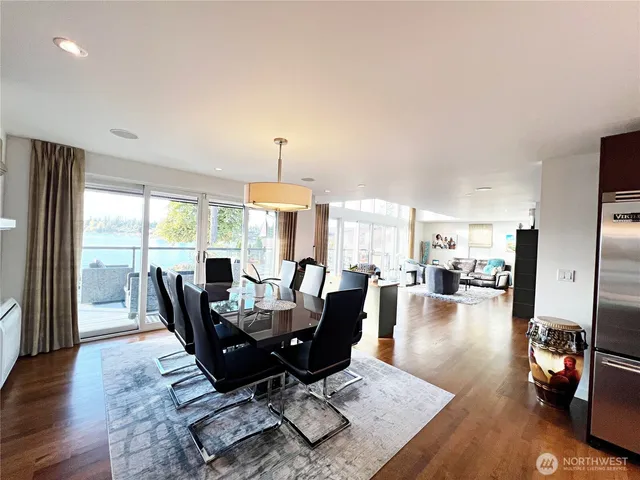 a view of a dining room with furniture window and wooden floor