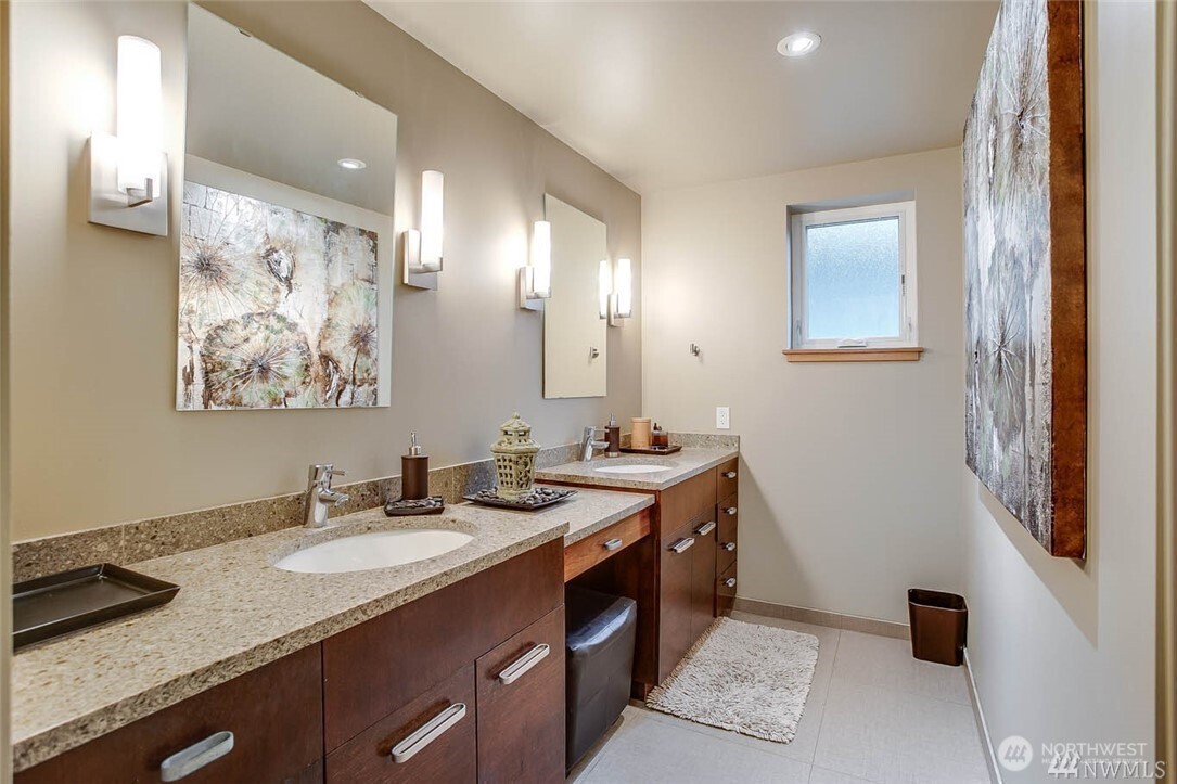 19605 Military Road South SeaTac, WA 98188 - Photo 21 of 40 a bathroom with a sink double vanity and a mirror